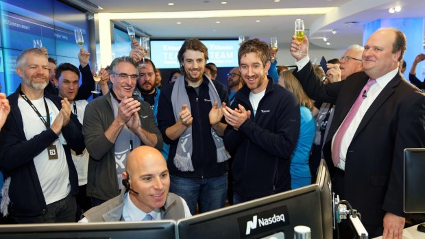 Atlassian's Mike Cannon-Brookes (centre left) and co-founder Scott Farquhar (right) and team celebrate as trading of shares begins after the company was listed on the Nasdaq.