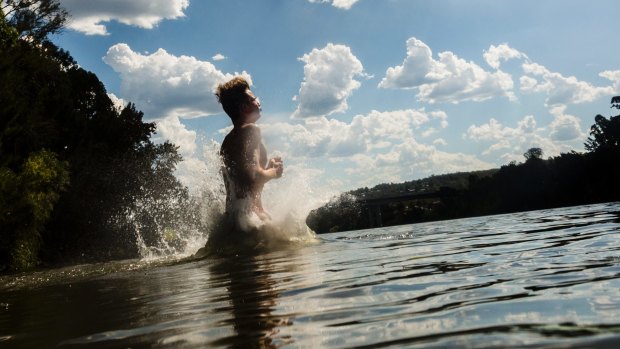 A man cools off in the Nepean River in Penrith on Sunday.