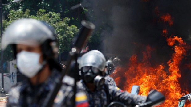 An explosion at Altamira square during polling day clashes in Caracas on Sunday.