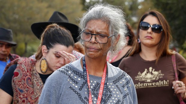 Jenny Munro and delegates address the media after walking out of the First Nations National Convention at Uluru.