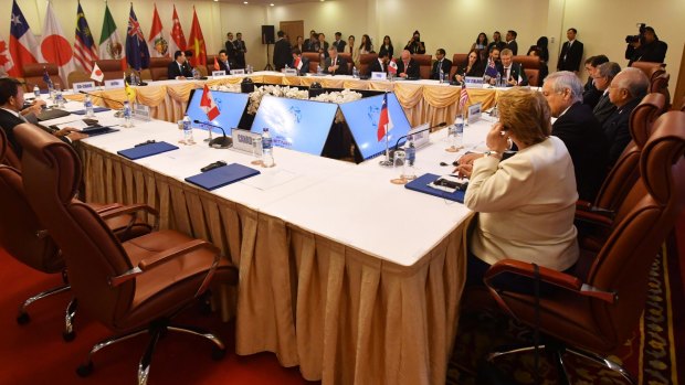 The empty seat (foreground) allocated for Canada's Prime Minister Justin Trudeau during a meeting for the Trans-Pacific Partnership.