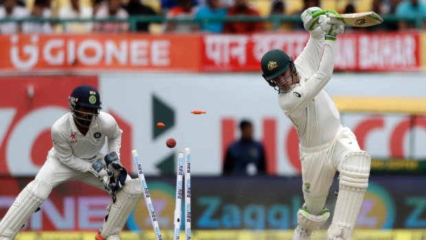 Deceived: Australia's Peter Handscomb is bowled by India's Kuldeep Yadav.