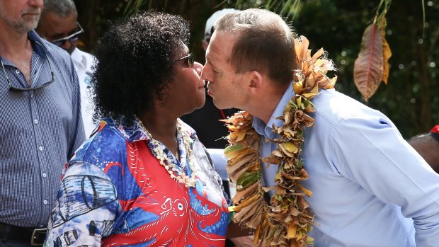 Gail Mabo and Prime Minister Tony Abbott during their visit to the grave of Eddie Mabo on Mer Island.