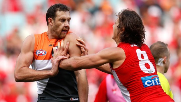 The Giants' Shane Mumford and the Swans' Kurt Tippett square off in the semi-final last September. 