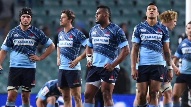 Faces tell the story: The Waratahs contemplate defeat to the Jaguares last weekend.