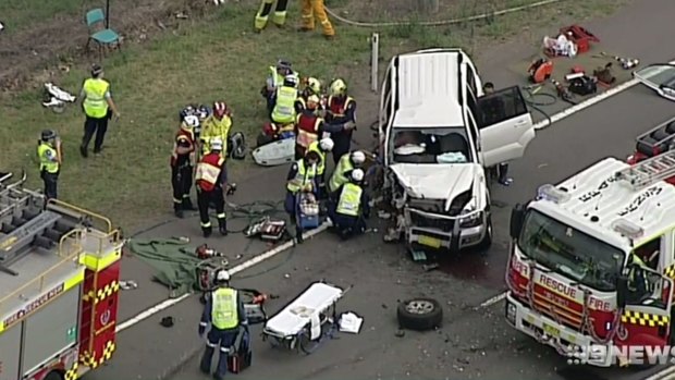 Emergency services attend a head-on car crash in Luddenham.