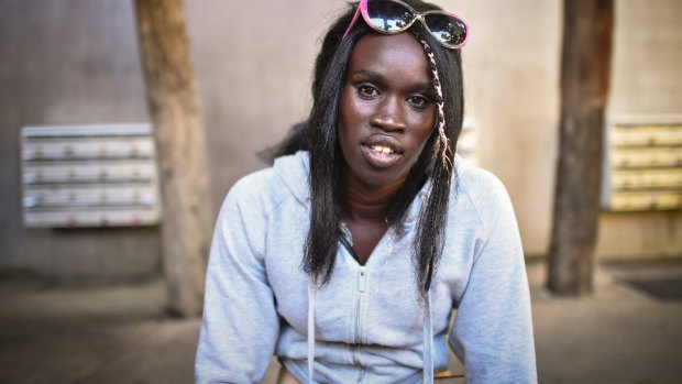 The girlfriend of the alleged Bourke Street driver, Akiir Muo outside his mother's home in Windsor.