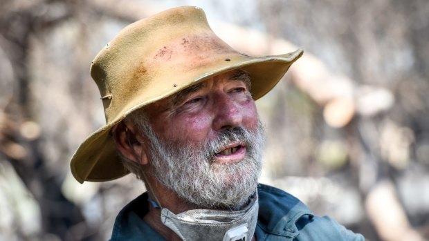 David Pope surveys the burnt-out wreckage of his shed.