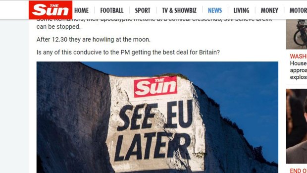 Screenshots of <i>The Sun</I> newspaper's website showing photos it published of a projection over the White Cliffs of Dover this week. 