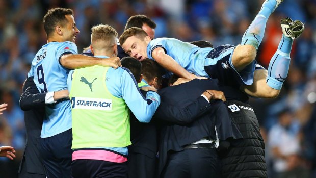 Home and hosed: Sydney FC celebrate winning the grand final earlier this month.