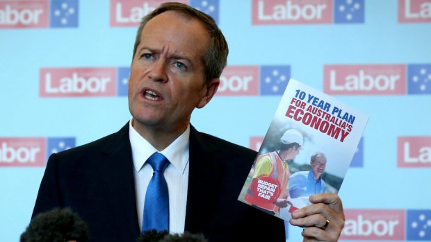 Mr Shorten with the Labor Party's election booklet. 