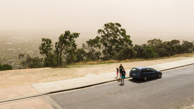 Dust settles over Canberra after strong winds bring particles from western NSW.