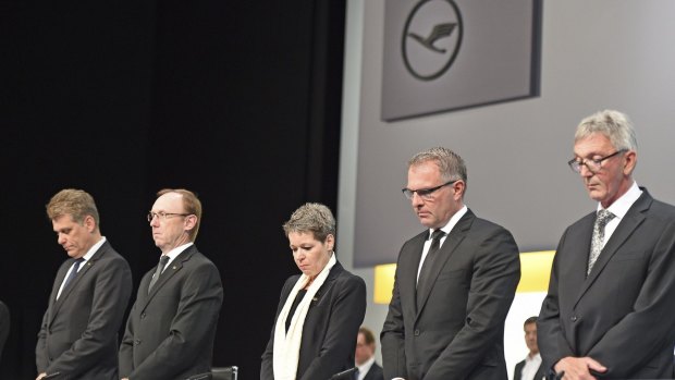 Lufthansa chief executive Carsten Spohr (second right) and board members observe a minute of silence for the victims of the Germanwings flight 4U9525 before the annual shareholders' meeting in Hamburg in April.  