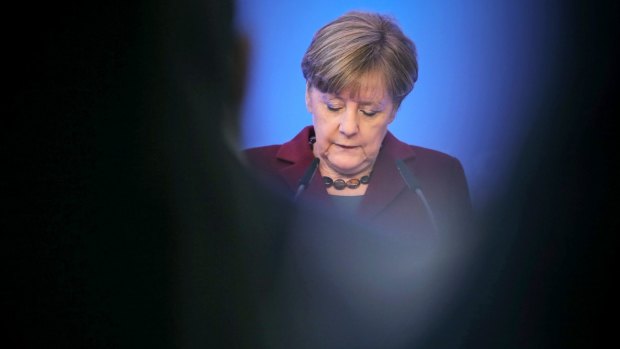 German Chancellor Angela Merkel has hardened her stance over migrants who break the law.