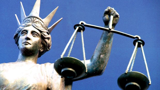 A Queensland University of Technology law lecturer has appeared in court on child-porn charges.