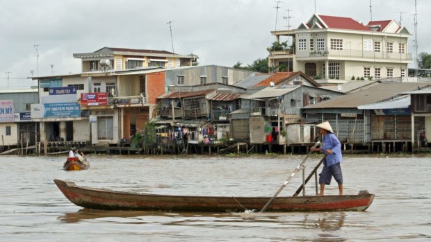 Local transport: A rowboat on the river at Cai Be.