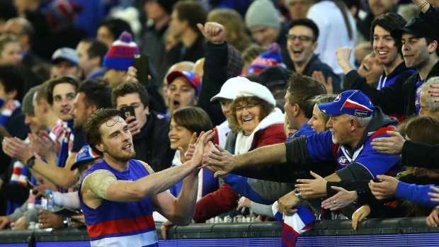 Jordan Roughead celebrates with Bulldogs fans after their win over Hawthorn.