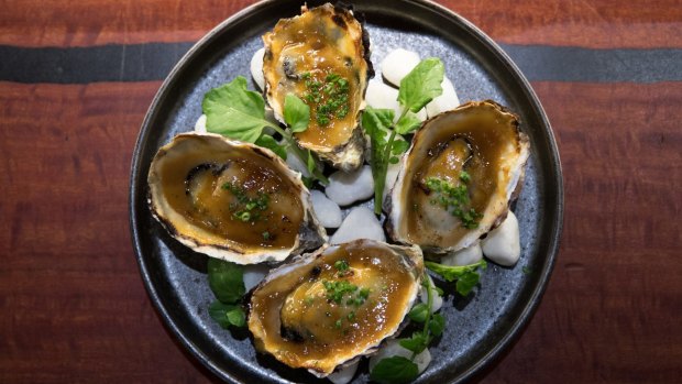 Oysters grilled in the shell and dressed with a rich yuzu miso cream.