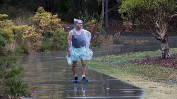 Robert Long goes on his daily walk in Sydney Park, despite the rain earlier this month.