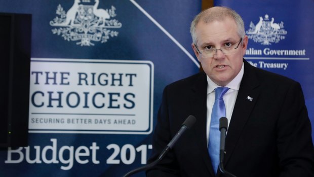 Treasurer Scott Morrison addresses the media during a press conference on the Mid Year Economic and Fiscal Outlook at Parliament House on Monday.