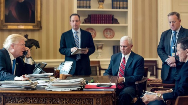 From left: US President Donald Trump, with Chief of Staff Reince Priebus, Vice-President Mike Pence, Press Secretary Sean Spicer and Michael Flynn, speaks on the phone with Russian President Vladimir Putin on January 28.