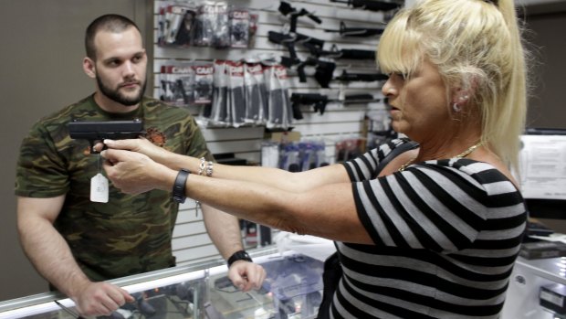 A woman in a gun store in the US South.