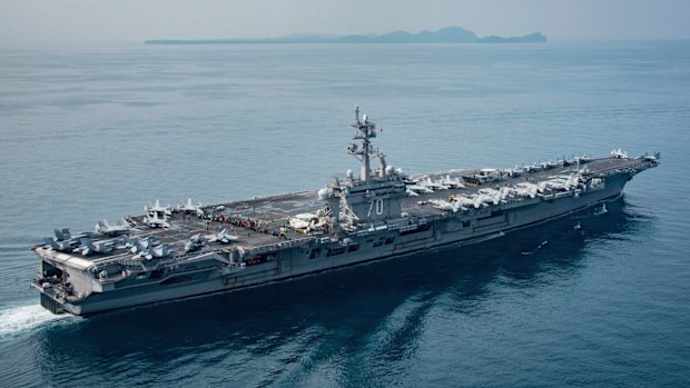 China has labelled the US Navy's decision to sail "without permission" close to an artificial island Beijing claims in the South China Sea as provocative.