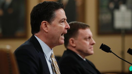 FBI Director James Comey, left, accompanied by National Security Agency Director Michael Rogers.