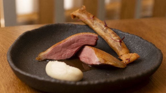 Aged duck breast with a spring roll filled with confit duck leg.