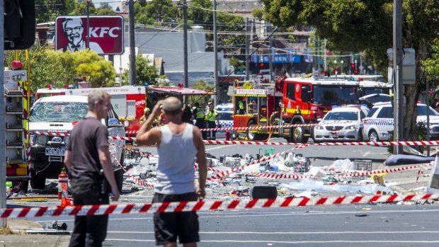 Residents at a cordon around the scene of the collision. 