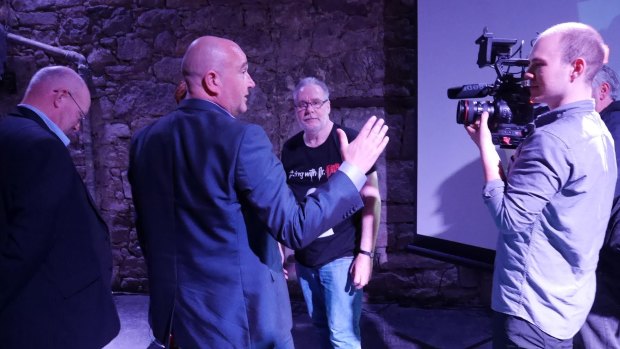 A TV crew films the police visit to Dr Nitschke's show at the Edinburgh Fringe Festival.