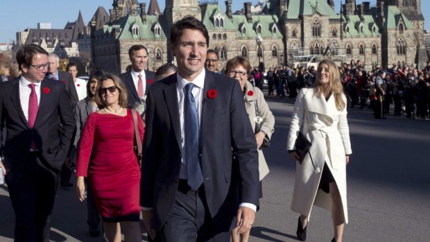 Prime Minister Justin Trudeau and his newly sworn-in cabinet arrive on Parliament Hill in Ottawa.