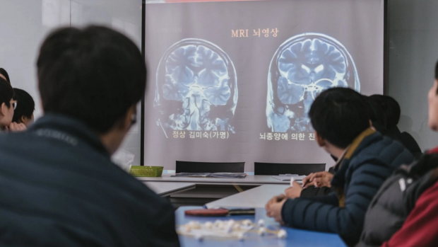 Participants watch a documentary on the impact of stress on the brain.