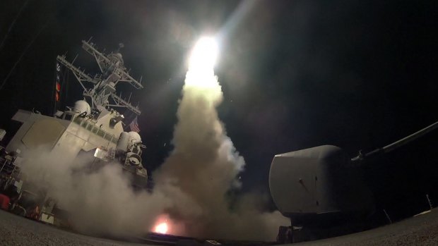 The guided-missile destroyer USS Porter (DDG 78) launches a tomahawk missile towards a Syrian air base in retaliation for this week's gruesome chemical weapons attack.