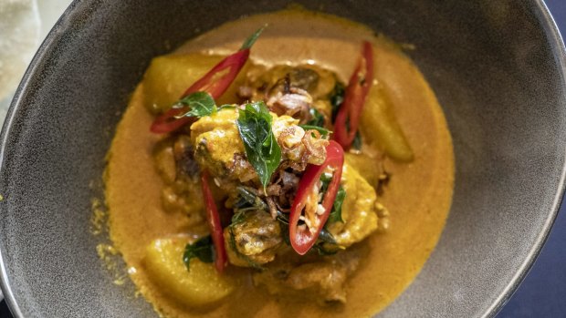 Cooking chicken curry from scratch during a class at The Fullerton Bay Hotel.