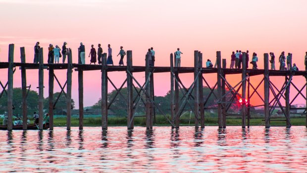 The extraordinary wooden U-Bein Bridge, spanning Taungthaman Lake near Mandalay, is one the sights on the Strand Hotel Cruise.