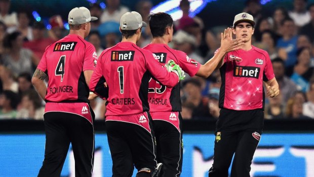 Disappointed: Sean Abbott (right) was smashed by Strikers batsman Travis Head.