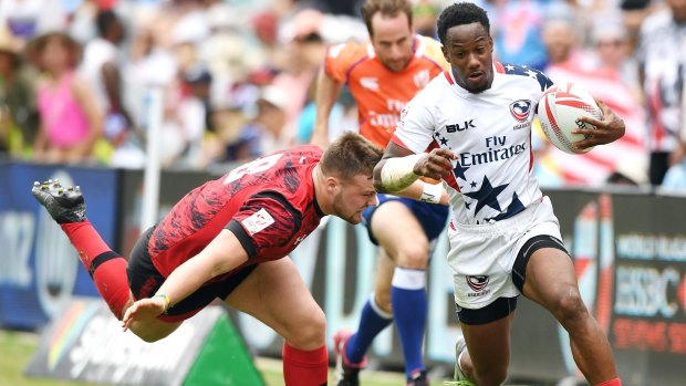 Speed machine: Carlin Isles of the USA beats the Welsh defence.