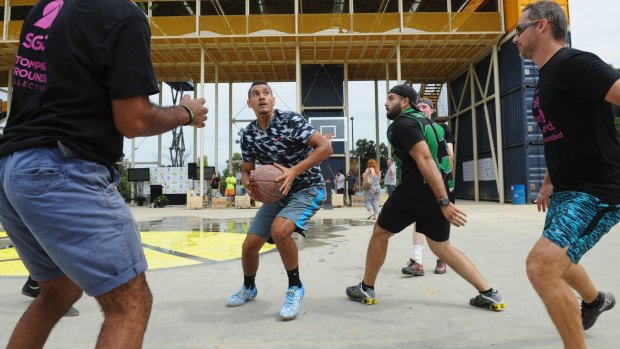 Hoops dream: Nick Kyrgios helps launch Westside at Acton Park in Canberra with a game of basketball in 2015. 