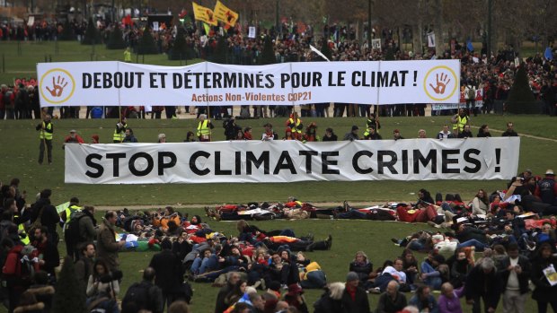 Activists gather during a demonstration on the final day of the COP21 conference in Paris.
