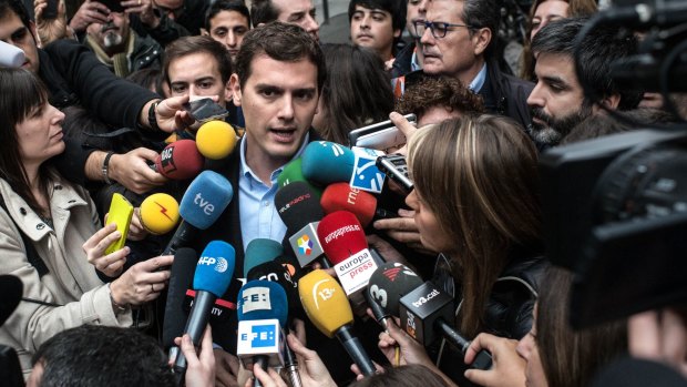 Ciudadanos (Citizens) leader Albert Rivera speaks to journalists after casting his vote at a polling station in Barcelona on Sunday. 