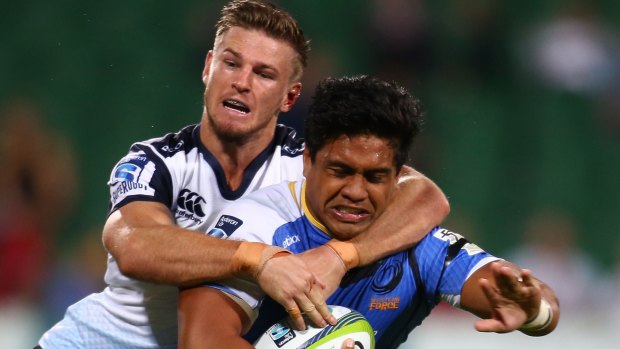 Tough year out west: Waratahs winger Rob Horne tackles Western Force player Ben Tapuai.