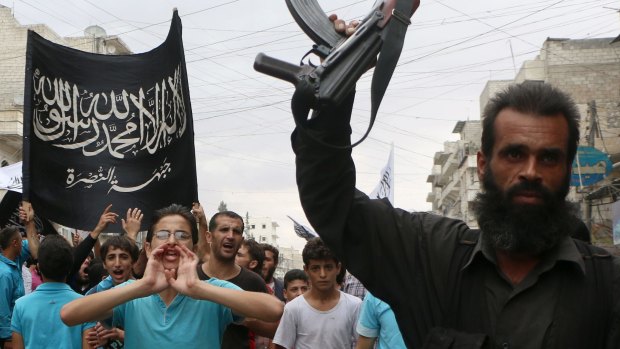 Al-Qaeda offshoot: Nusra Front supporters take part in a protest in Syria. 