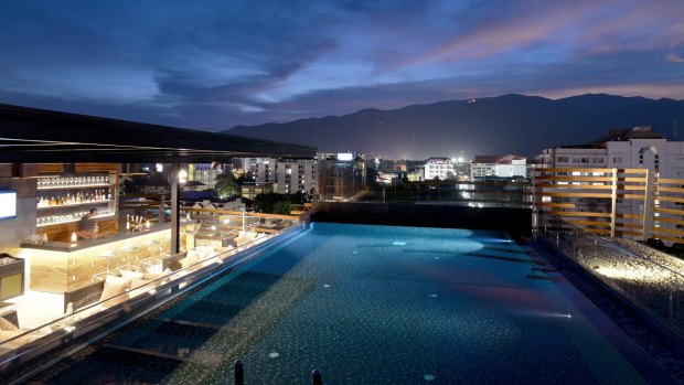 The spectacular rooftop infinity pool at luxury boutique hotel akyra Manor Chiang Mai.
