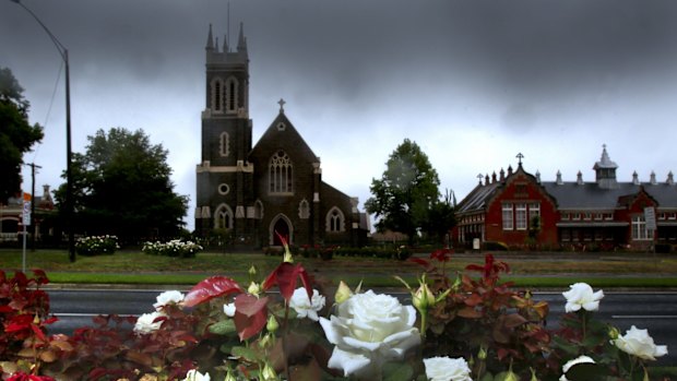 St Alipius Presbytery, a church and old boys' school in Ballarat, has ribbons tied to the fence to pay tribute to the victims and survivors of child abuse.