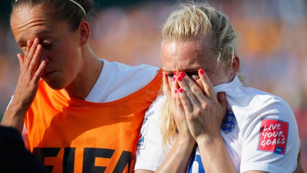 Laura Bassett is comforted by Jo Potter after her own goal eliminated England from the World Cup.