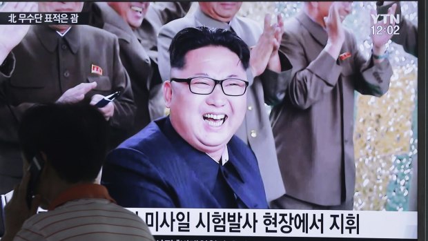 A TV news channel shows an image of North Korean leader Kim Jong-un.