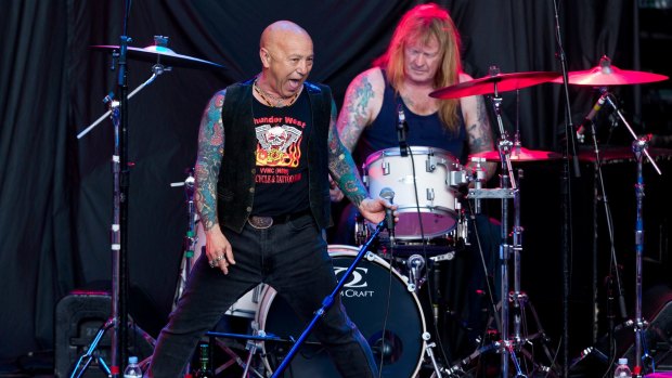 Former Rose Tattoo drummer Paul DeMarco on stage with Angry Anderson. DeMarco has pleaded guilty to conspiring to supply guns. 