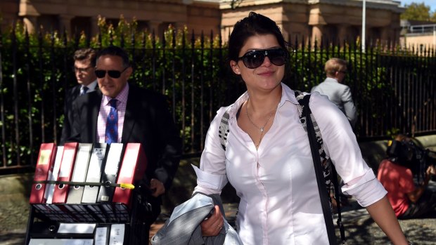 Katherine Abdallah leaves the NSW Supreme Court on Monday. Abdallah was found not guilty of the stabbing murder of her cousin, Suzie Sarkis, but guilty of manslaughter.