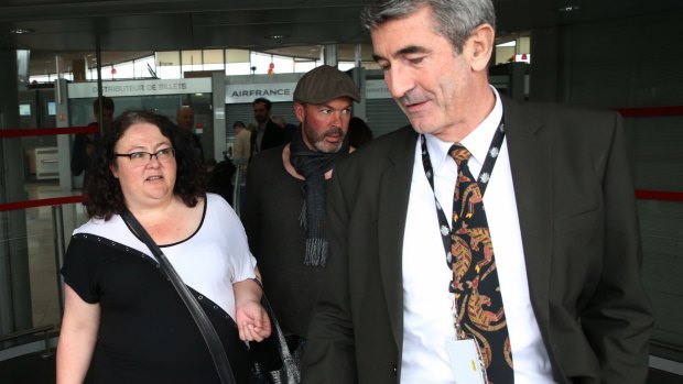 Lisa Parkinson is greeted by an Australian Embassy official at the airport in Paris.